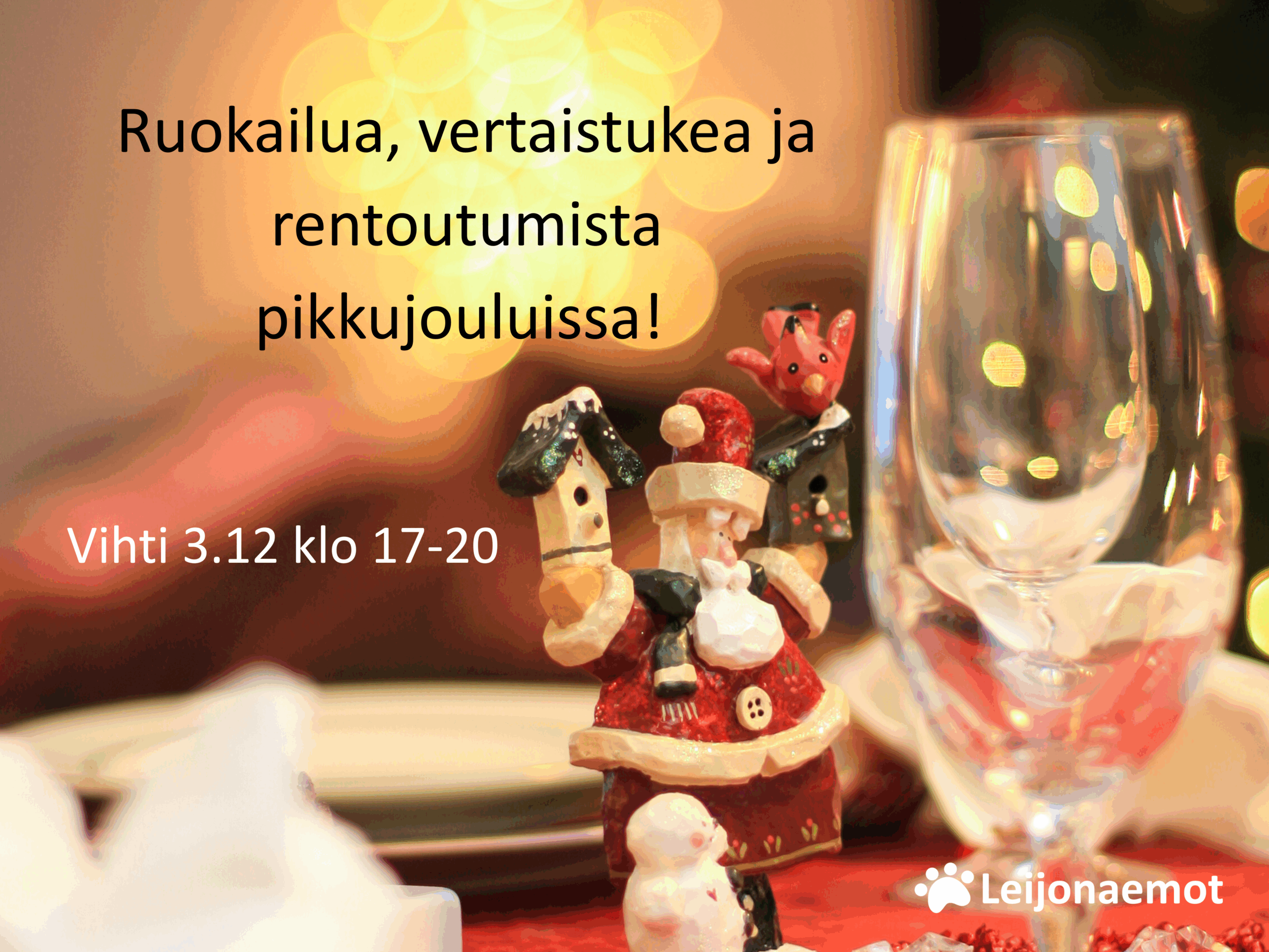 Tunnelmallisessa kuvassa pieni punainen joulupukkipatsas on keskellä juhlapöytää.